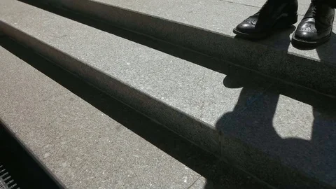 Close up of stylish man s shoes in which he is walking on stairs in time of a Stock Footage 73813475