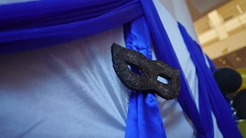 Close-up of a stylish silver mask decoration for a festive and joyful party.. Video stock 331788593