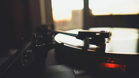 Close-up Stylus Dropping on Vinyl Record Player in Soft Light Stock Footage 319415340