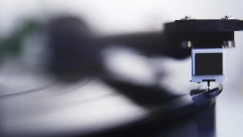 Close up of stylus or needle being lowered onto spinning vinyl record Stock Footage 140579095
