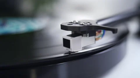 Close up of stylus or needle on turntable with vinyl record spinning Stock Footage 140552701