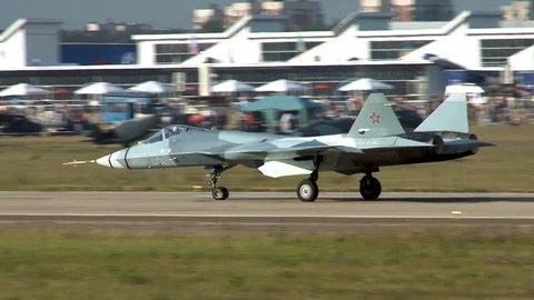Close-up of Su-57 fifth-generation multi-functional fighter taxiing along runway Stock Footage 115394987