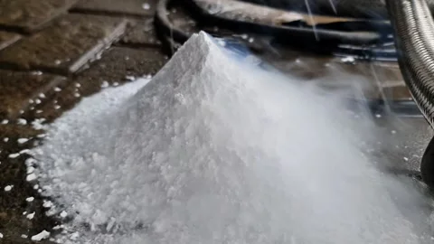 Close up of Sublimating Dry Ice Pile with Rising Cold Vapor on Industrial Floor Stock Footage 333180749