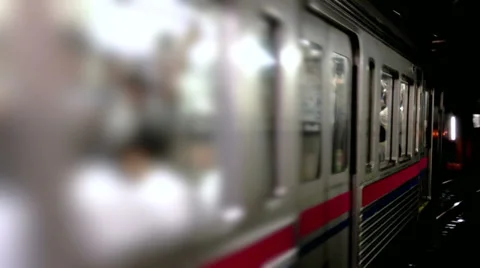 Close up of subway train leaving station in Tokyo, Japan Stock Footage