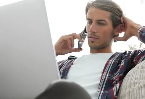 Close-up of a successful guy talking to a smartphone Stock Photos