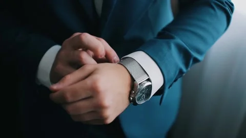 Close-up of a successful man is putting on a watch. Men's hand with a watch Stock Footage 130588264