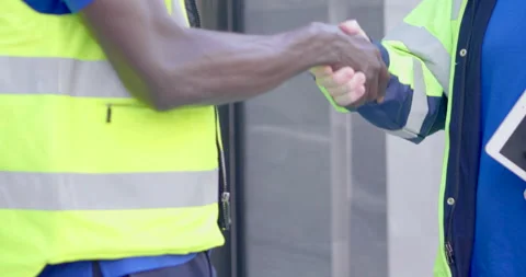 Close up successful shake hands two diversity African and Caucasian industria Video stock 150417128