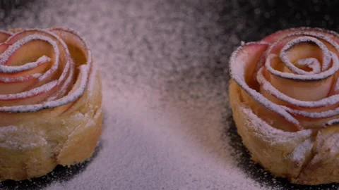 Close Up of Sugar Sprinkles falling on Fresh Apple Rose Pie Stock-Footage 130764731