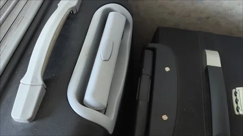 Close-up of a suitcase handle. the concept of moving. travel. Packing a suitcase Stock Footage 313264110