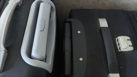 Close-up of a suitcase handle. the concept of moving. travel. Packing a suitcase Stock Footage 313264273