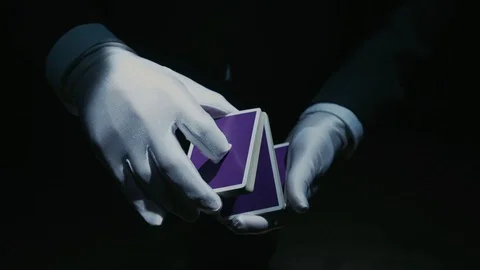 Close-up of a Suited Magician's Hands Performing Sleight of Hand Card Tricks Stock Footage 129358902