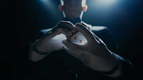 Close-up of a Suited Magician's Hands Performing Sleight of Hand Card Tricks Stock Footage 129358934