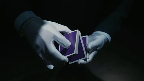 Close-up of a Suited Magician's Hands Performing Sleight of Hand Card Tricks Stock Footage 129359004