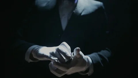 Close-up of a Suited Magician's Hands Performing Sleight of Hand Card Tricks Stock Footage