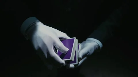 Close-up of a Suited Magician's Hands Performing Sleight of Hand Card Tricks Stock Footage 180378934