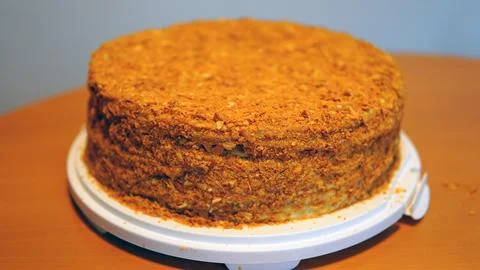 A close-up of a sumptuous Napoleon cake with multiple flaky layers filled w.. Stock Photos