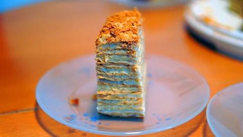A close-up of a sumptuous Napoleon cake with multiple flaky layers filled wit Stock Photos