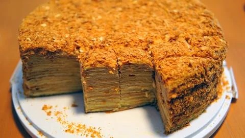 A close-up of a sumptuous Napoleon cake with multiple flaky layers filled wit Stock Photos