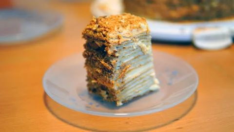A close-up of a sumptuous Napoleon cake with multiple flaky layers filled w.. Stock Photos