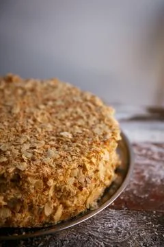 A close-up of a sumptuous Napoleon cake with multiple flaky layers filled wit Stock Photos