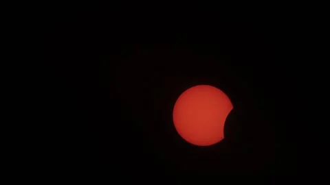 Close-up of Sun During Early Phase of Solar Eclipse Against Black Sky Stock-Footage 347344552
