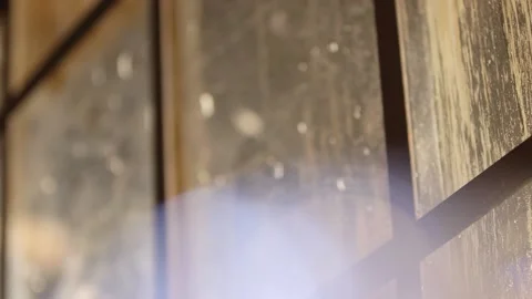 Close up of sun lit winter windows with bokeh Stock Footage 136340194