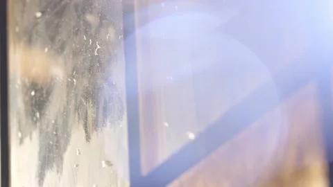 Close up of sun lit winter windows with bokeh Stock Footage 136340200