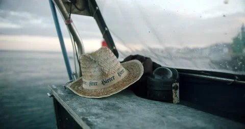 Close up of sun protective straw hat on fishing boat Stock Footage 161193908