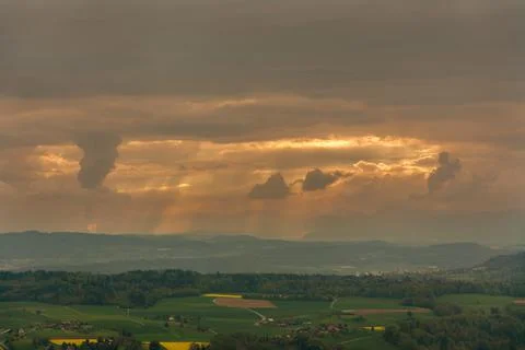 Close-up of sun rays bursting through clouds Stock Photos