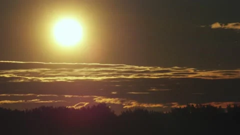 Close up on sun in the sky one hour after sunrise Stock Footage 130863722