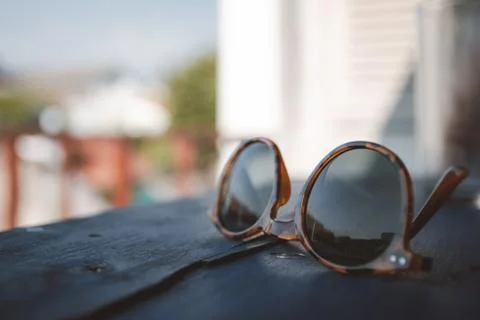 Close-up of sunglasses on a table Stock Photos