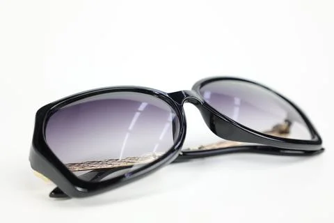 Close-up of sunglasses on white background Фото