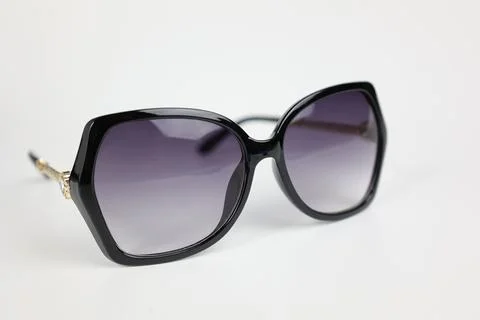 Close-up of sunglasses on white background Фото