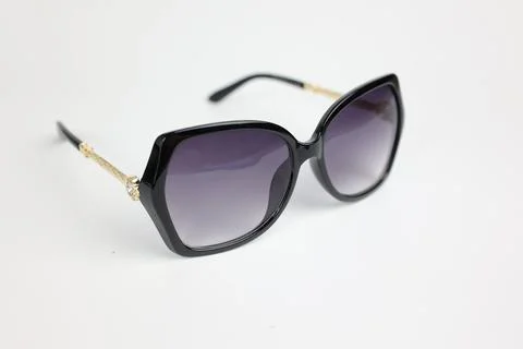 Close-up of sunglasses on white background Фото