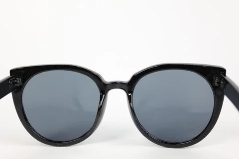 Close-up of sunglasses on white background Фото