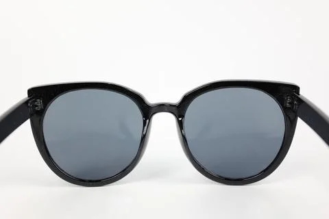 Close-up of sunglasses on white background Фото