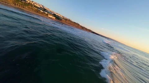 Close-up of sunlit ocean waves at dusk Stock Footage 344558047