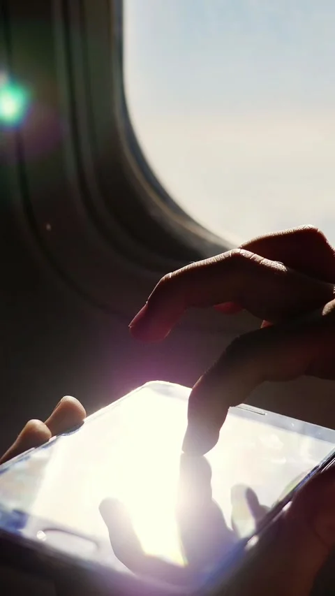 Close-up. the sun's rays are reflected in the phone. dark silhouette of kid Video stock 320536151