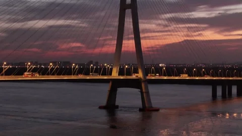 Close sunset aerial of cable stayed bridge tower and traffic in China Stock Footage 337767278