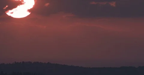 Close up of a sunset behind clouds Stock Footage 80808783