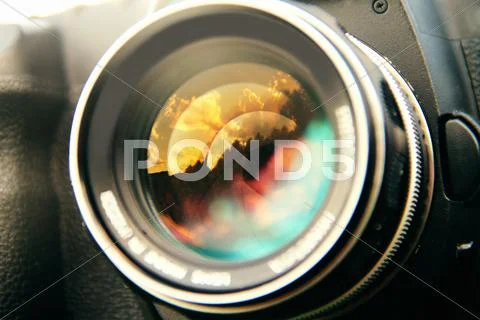 Close Up Sunset Clouds Reflected In Camera Lens