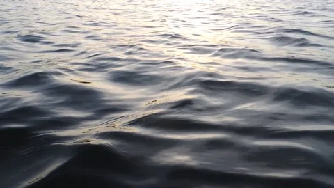 Close up sunset sea ocean river water surface calm ripple wave texture pattern Stock Footage 201884330