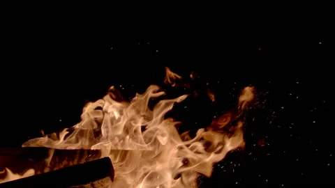Close-up: super slow motion of fire line isolated on black background. Filmed on Stock Footage 146619648