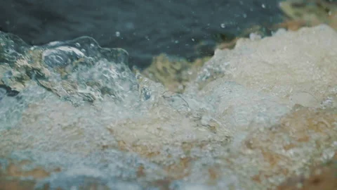 Close-up Super slow-motion shooting of the rapid river threshold. Stock Footage 157370875