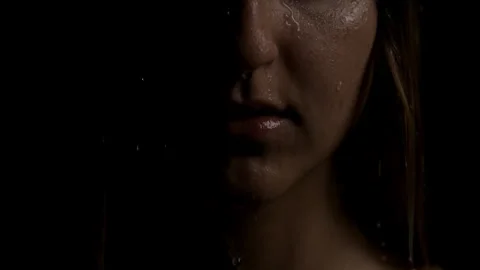 Close up Super Slow Motion Shot of a Woman Sprinkled with Raindrops Stock Footage 270397725