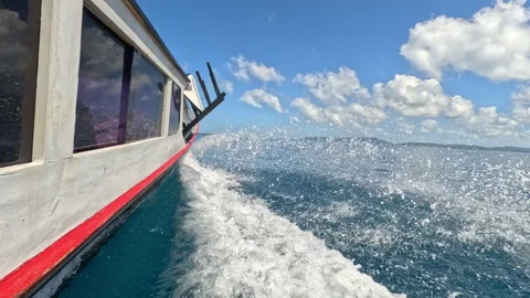 CLOSE UP: Surf taxi slicing through blue Indian Ocean in the Mentawai Islands Stock Footage 338361182