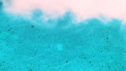 Close up surface of blue water on textured floor with smoke and bubbles in pool Stock Footage 315287331
