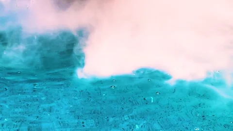 Close up surface of blue water on textured floor with smoke and bubbles in pool Stock Footage 316316715