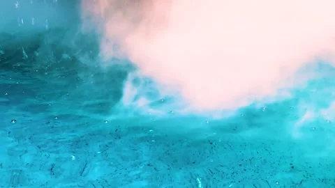 Close up surface of blue water on textured floor with smoke and bubbles in pool Stock Footage 316463015