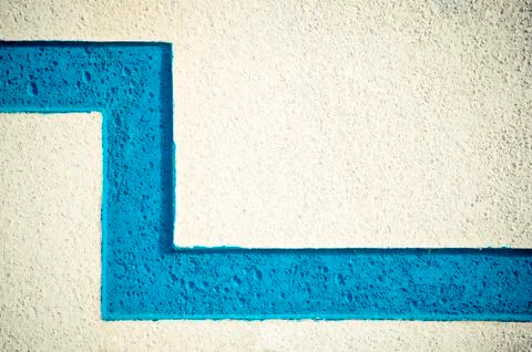 Close-up of the surface of the cement wall, painted with a blue line Stock Photos
